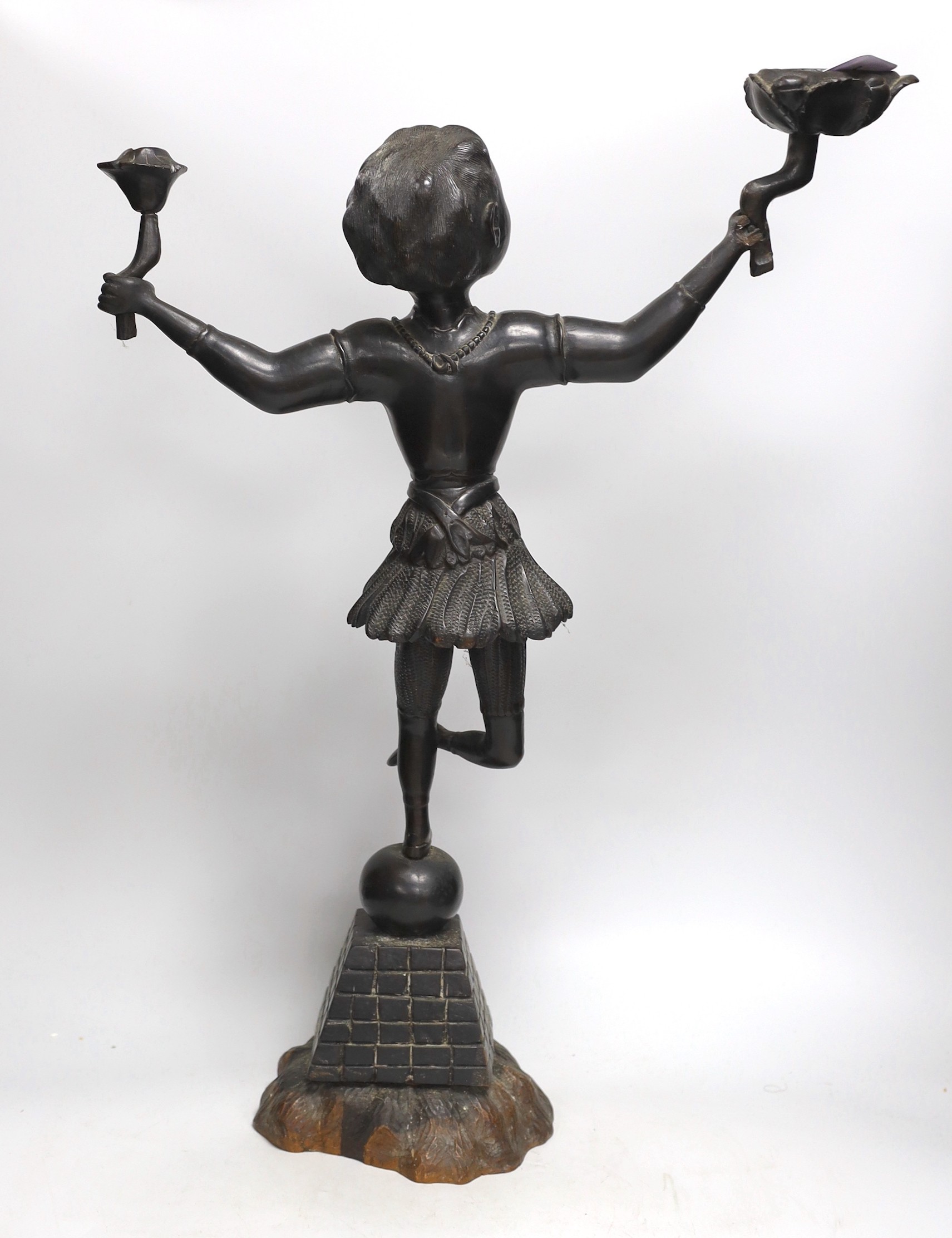 An unusual 19th century Ceylonese carved ebony figure, 91cm high